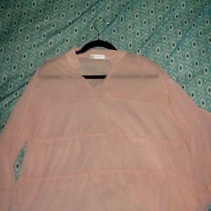 Pink , see through blouse.